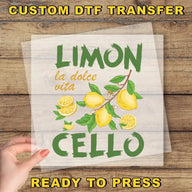 a hand holding a transparent sheet with a design of lemons and the text "LIMON la dolce Vita Cello" printed on it.