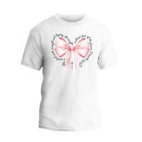 a white t - shirt with a pink bow in the shape of a heart