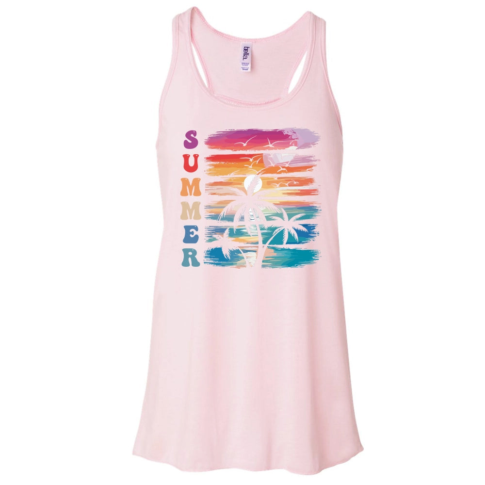 A pink tank top with a graphic design depicting a palm tree and a sunset on a beach.