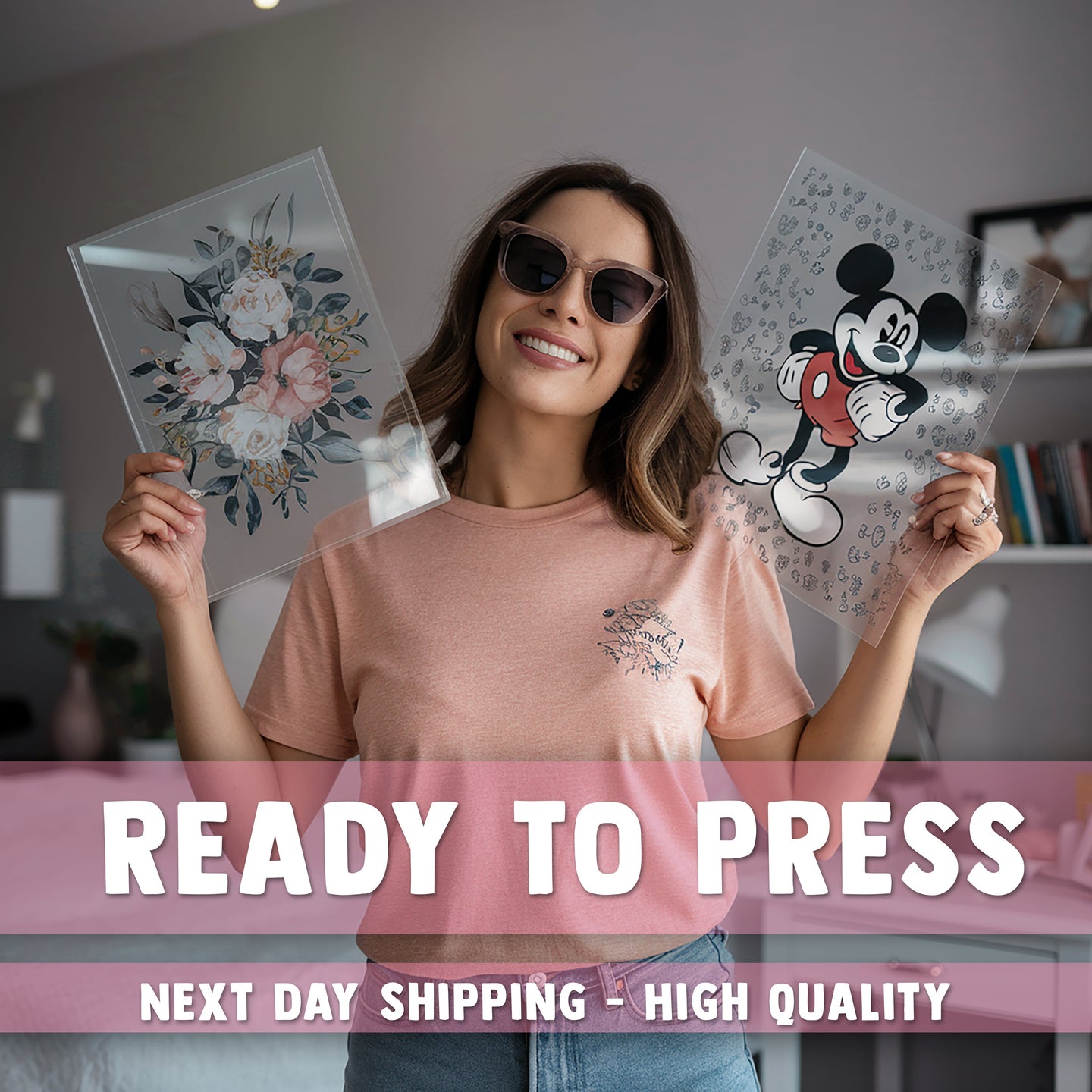 a woman holding up a pair of mickey mouse cut outs