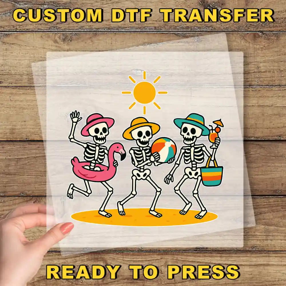 A hand is holding a clear sheet with a cartoon illustration of three skeletons dressed in summer attire, including hats, sunglasses, and beach accessories, dancing on a beach.