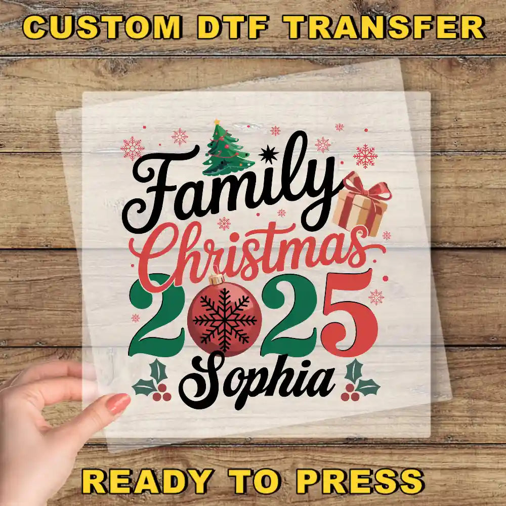 a hand holding a piece of paper with a christmas tree on it