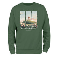 a green sweatshirt with a picture of a cross on it