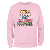 a pink sweatshirt that says it's a good day to ride horses