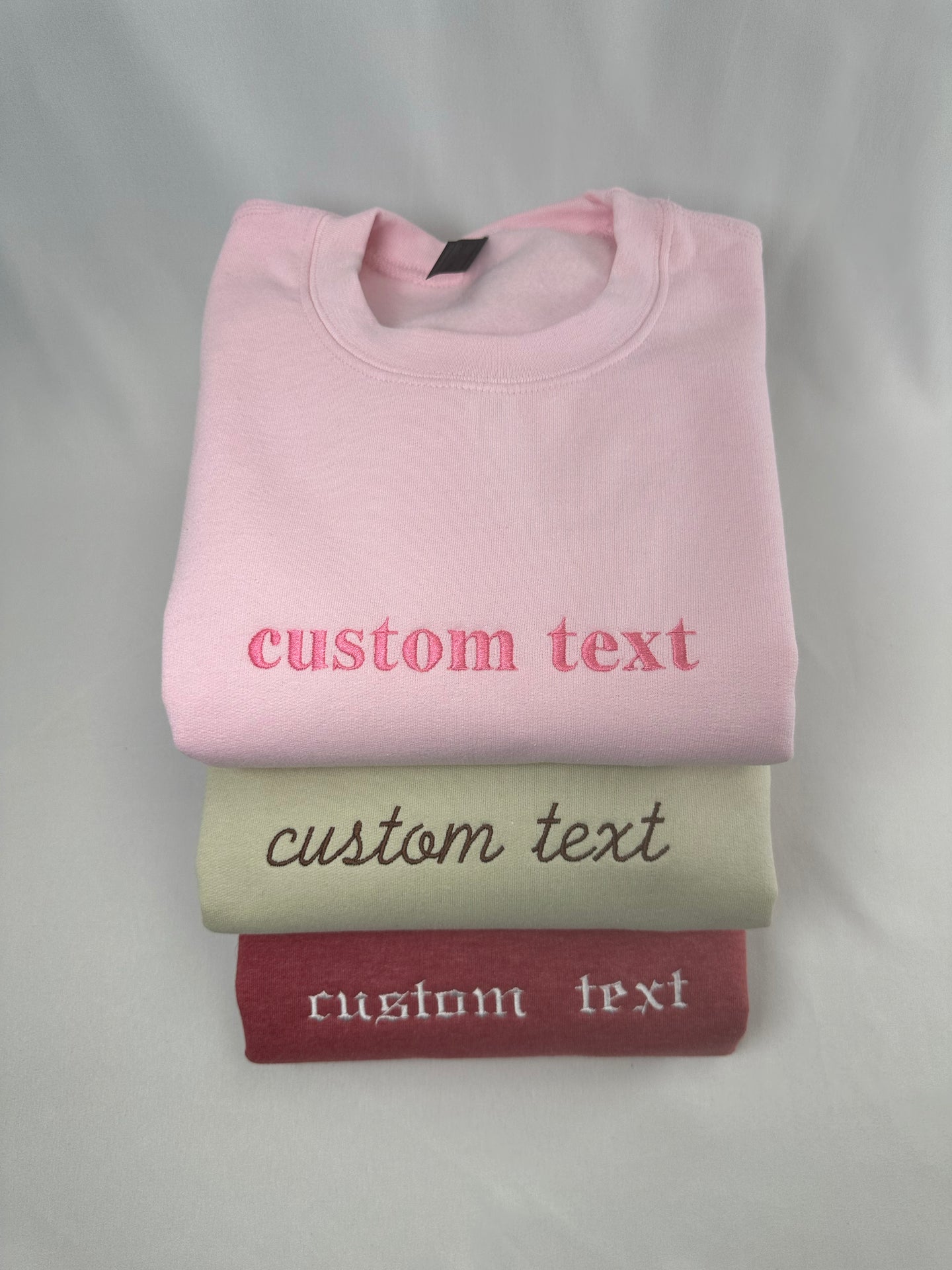 a stack of three t - shirts sitting on top of each other