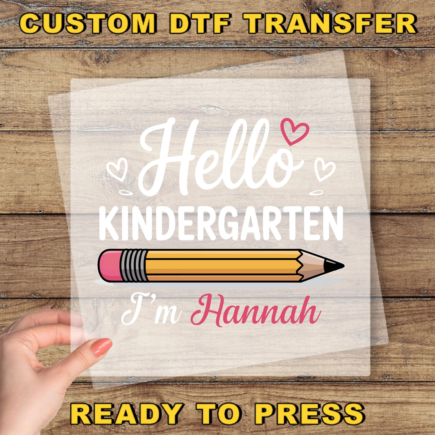 A hand holding a piece of paper with a pencil and the text "Hello Kindergarten I'm Hannah" printed on it.