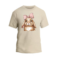 a t - shirt with a picture of a rabbit wearing a bow