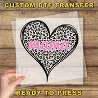 a hand holding a piece of paper with a heart on it