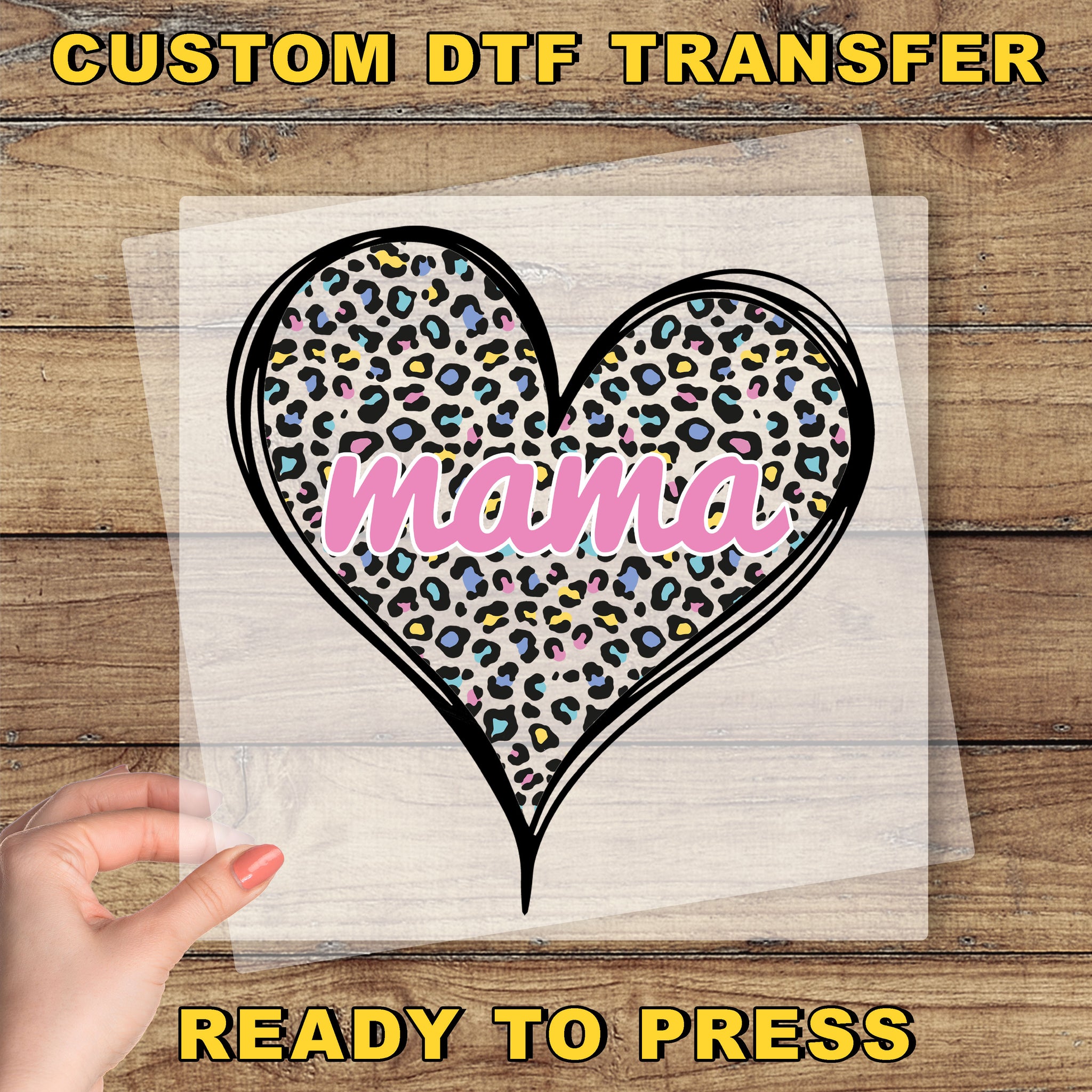 a hand holding a piece of paper with a heart on it