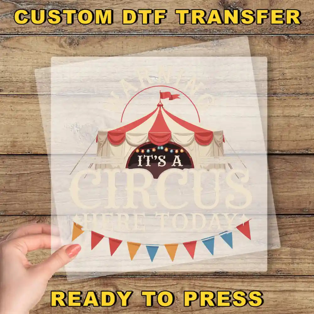 a person holding a piece of paper with a circus tent on it