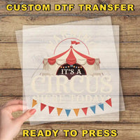 a person holding a piece of paper with a circus tent on it