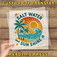a hand holding a clear sheet with a vibrant, tropical-themed design on it. The design includes palm trees, a sun, and waves, conveying a sense of relaxation and enjoyment. The text "Salt Water and Sun Shine" is prominently displayed, suggesting a connection to the beach and the sun. The phrase "READY TO PRESS" is also visible, indicating that the image is ready to be printed or used.