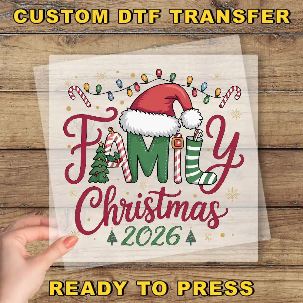 The image is a hand holding a transparent sheet with a festive Christmas-themed design, including a Santa hat, Christmas lights, and a family tree.