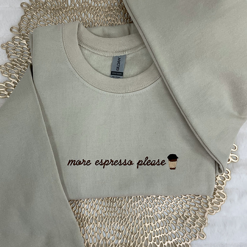 a white shirt with a cupcake embroidered on it