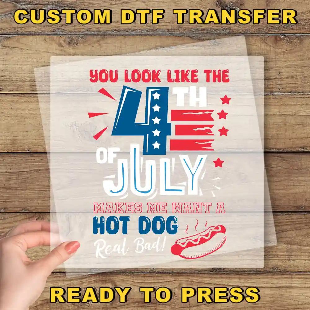 a hand holding a clear sheet with a patriotic design related to the 4th of July holiday.