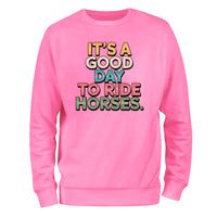 a pink sweatshirt that says it's a good day to ride horses