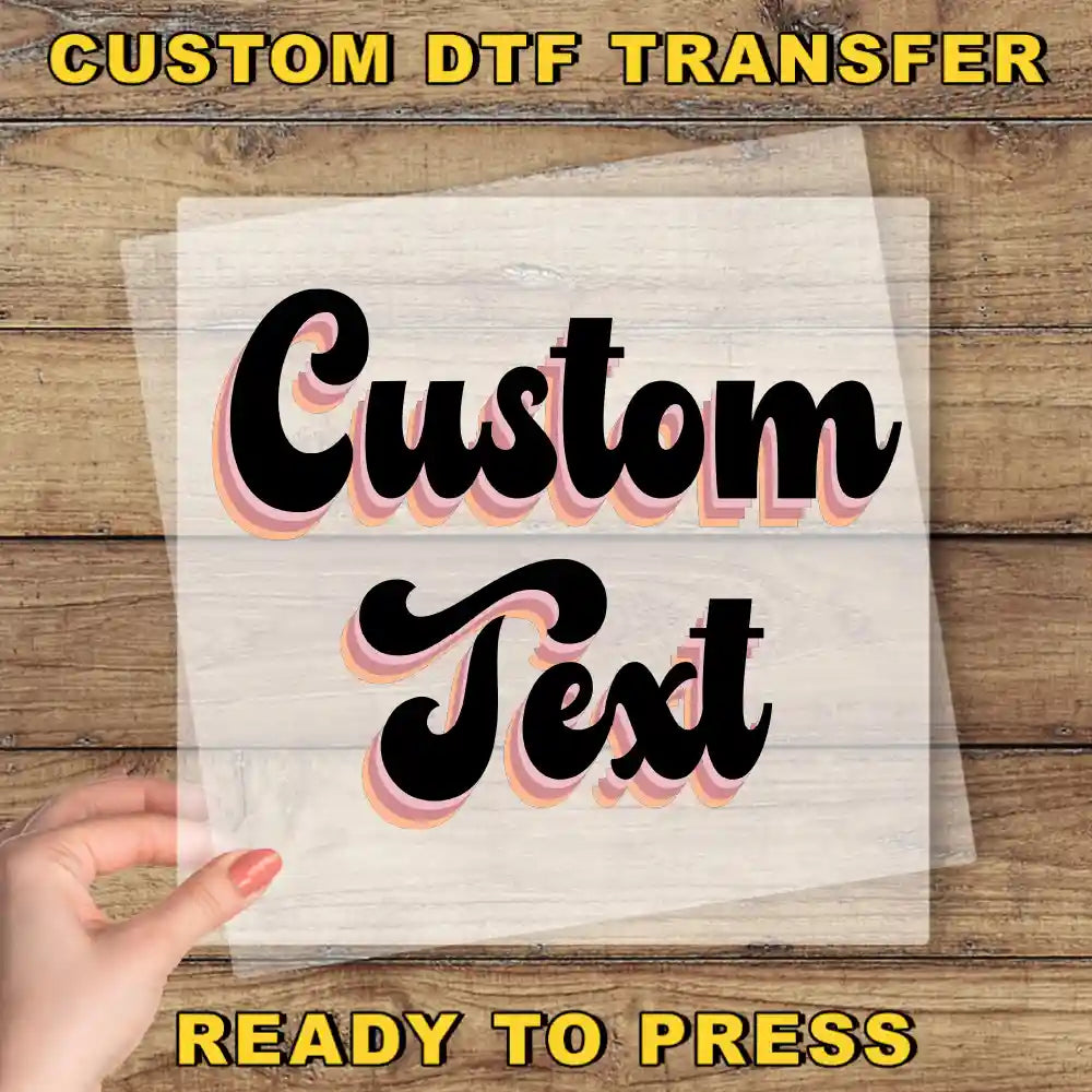 a hand holding a piece of paper with the text "Custom Text" written on it, against a wooden background.