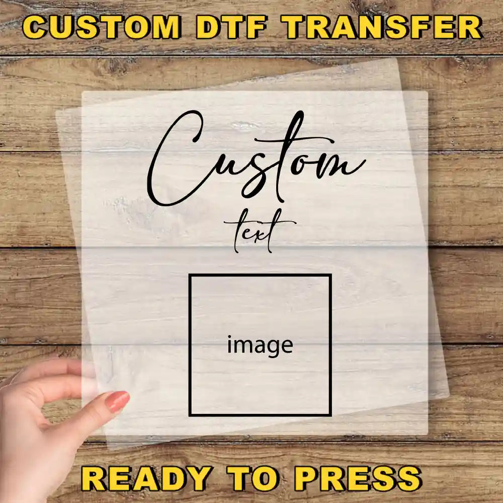 A hand holding a transparent sheet with the text "Custom Dtf Transfer" and "image" written on it, along with the phrase "Ready to Press" at the bottom.