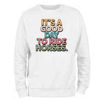 a white sweatshirt that says it's a good day to ride horses