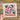 The image is a hand holding a clear sheet with a Christmas-themed design, including a candy cane, holly leaves, and a baby's foot.