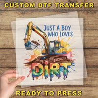 a hand holding a piece of paper that says, just a boy who loves dirt