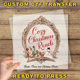 a hand holding a piece of paper with the words cozy christmas reads ready to press