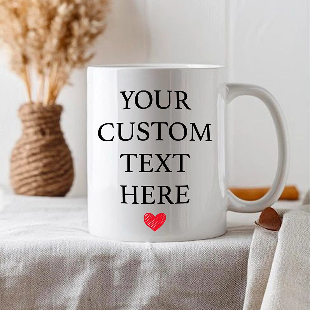 a white coffee mug with a red heart on it
