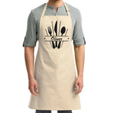 a man wearing an apron with a knife and fork on it