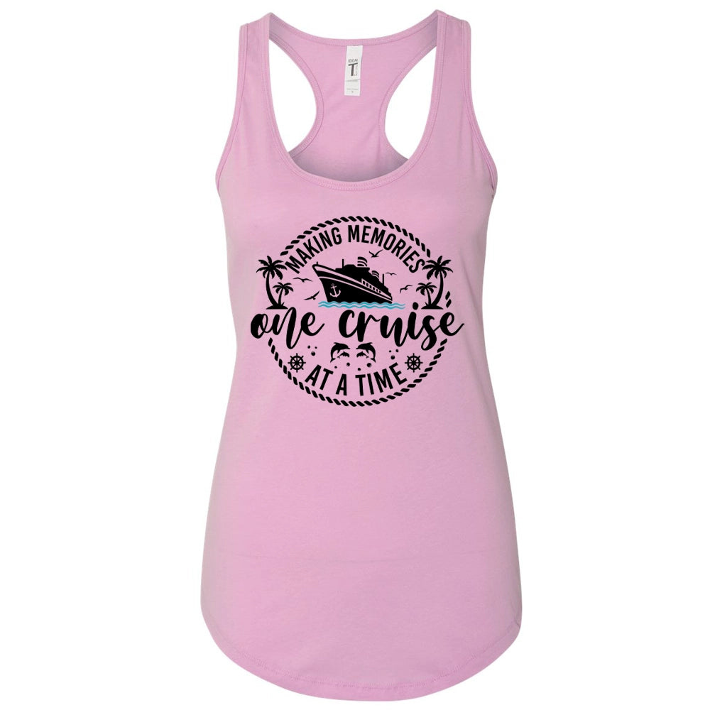 A pink tank top with a graphic design featuring a cruise ship and the text "Making memories one cruise at a time".