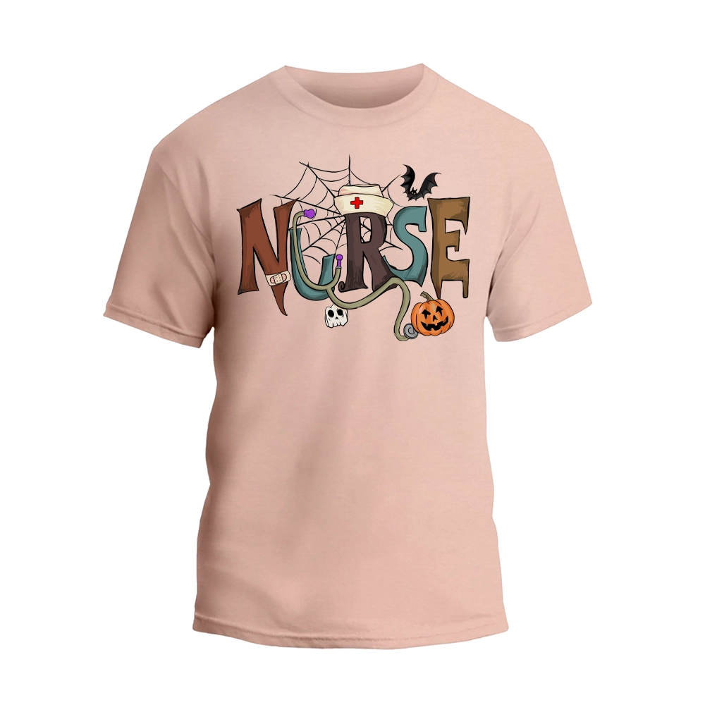 A light pink t-shirt with the word "NURSE" written in a creative and colorful design, featuring a spider web, bats, a pumpkin, and other Halloween-themed elements.