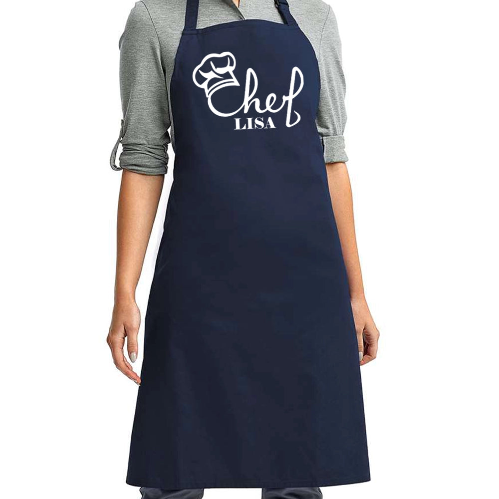 a woman wearing a chef's apron with a chef's name on it