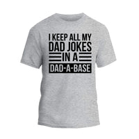 a grey t - shirt that says i keep all my dad jokes in a dad