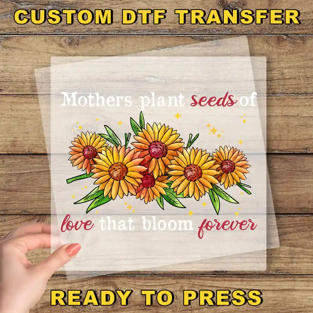 a hand holding a piece of paper with flowers on it
