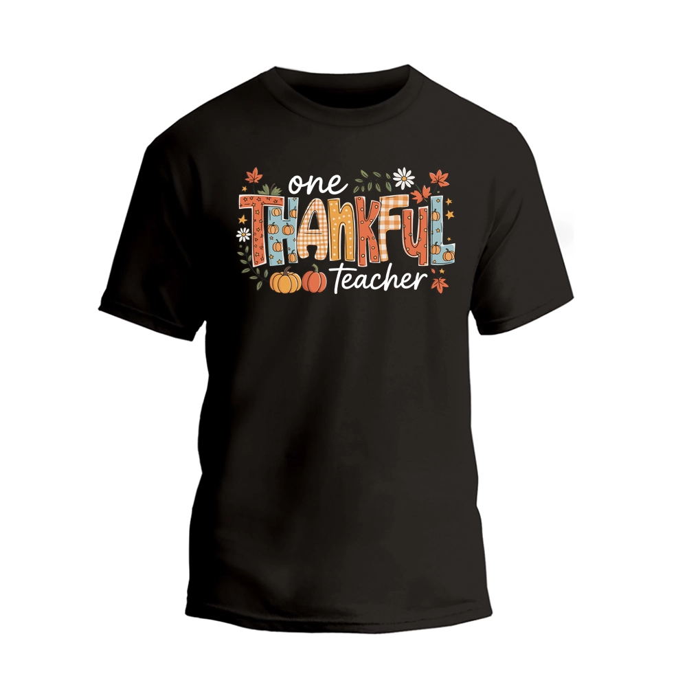 A black t-shirt with a colorful graphic design that says "One Thankful Teacher" in a stylized font.