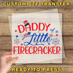 a hand holding a piece of paper with the words daddy of a firecracker