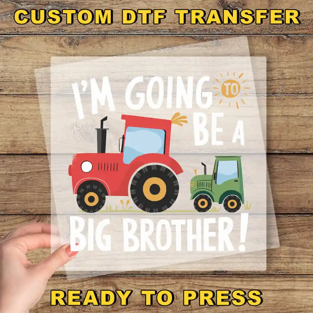 a hand holding a paper with a tractor on it