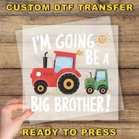 a hand holding a paper with a tractor on it