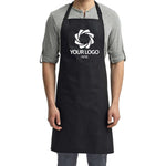 a man wearing a black apron with a logo on it