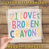 a person holding a piece of paper with the words i love broken crayos