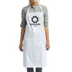 a woman wearing a white apron with your logo on it