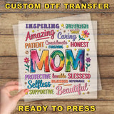 a hand holding up a piece of paper with the words mom on it