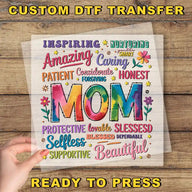 a hand holding up a piece of paper with the words mom on it