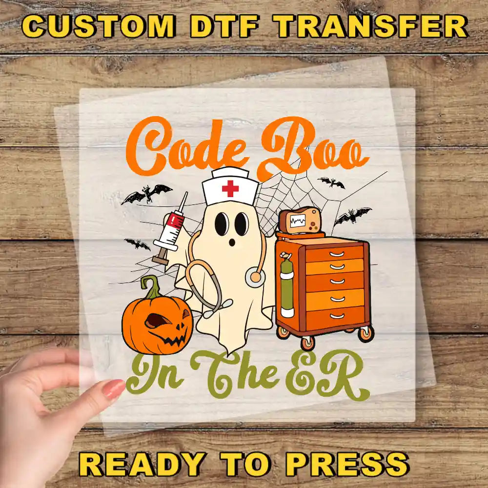 a hand holding a paper with a picture of a ghost on it