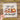 The image is a hand holding a transparent sheet with a design featuring a candle, a mug with a leaf, and a pumpkin surrounded by autumn leaves. The text on the sheet reads "Just a girl who loves fall" and "Ready to press".