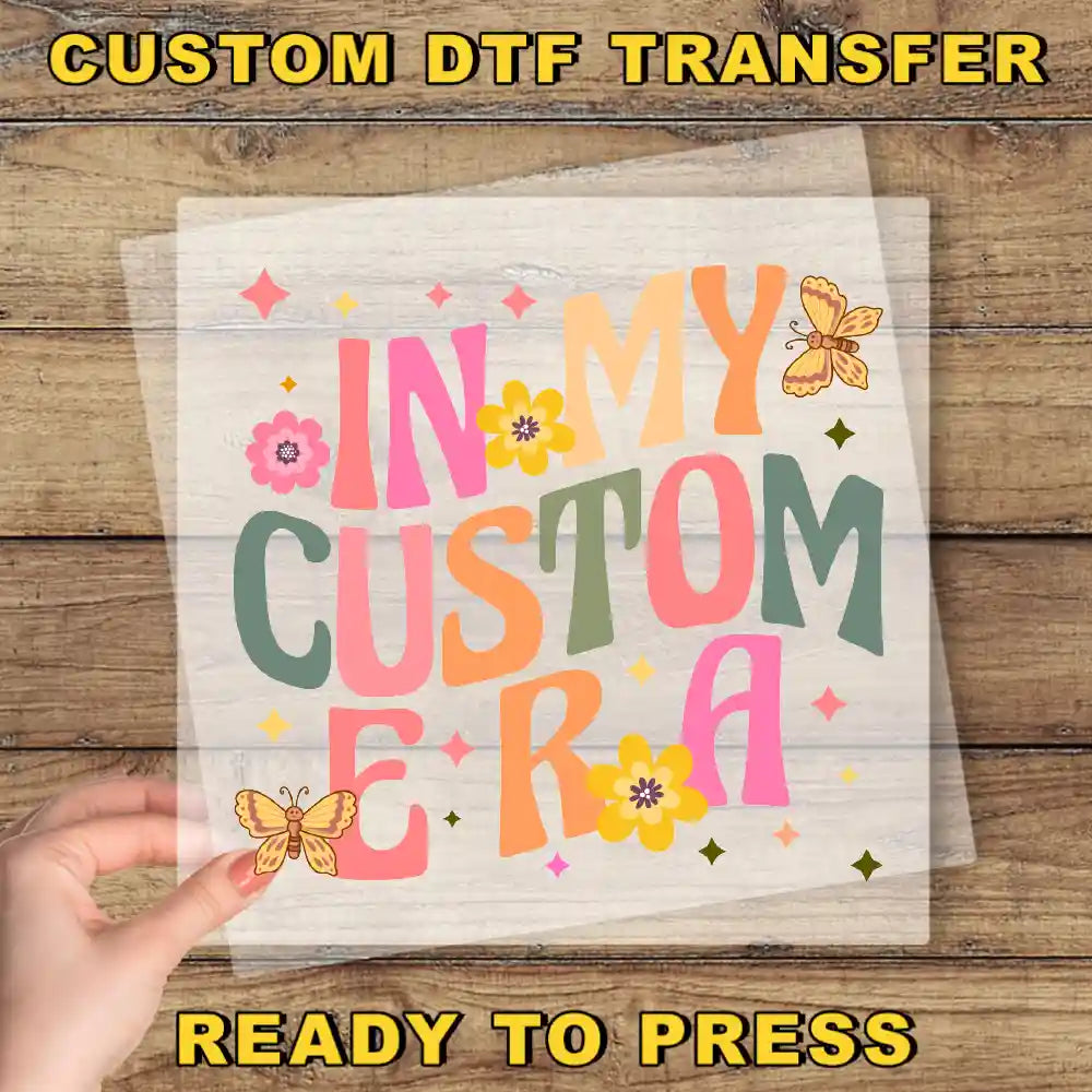 a hand holding a piece of paper with the words in my custom era