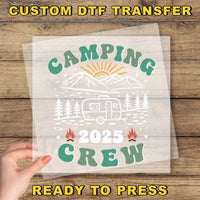 a person holding up a paper with a camper on it