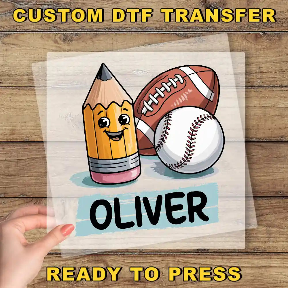 A hand is holding a transparent sheet with a cartoon image of a pencil, a baseball, and a football, along with the name "Olivier" written below.