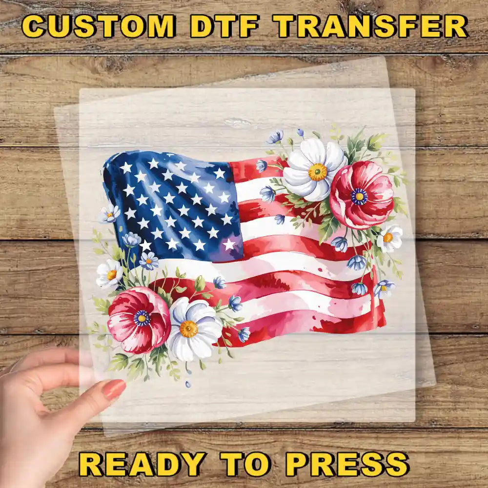 a hand holding a piece of paper with an american flag on it