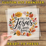 a hand holding a transparent sheet with a hand-drawn wreath design and text that reads "Fall for Jesus He never leaves".