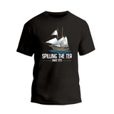 a black t - shirt with a sailing the tea logo on it